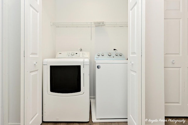 clothes washing area with independent washer and dryer