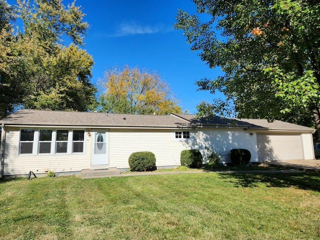 single story home with a front lawn and a garage