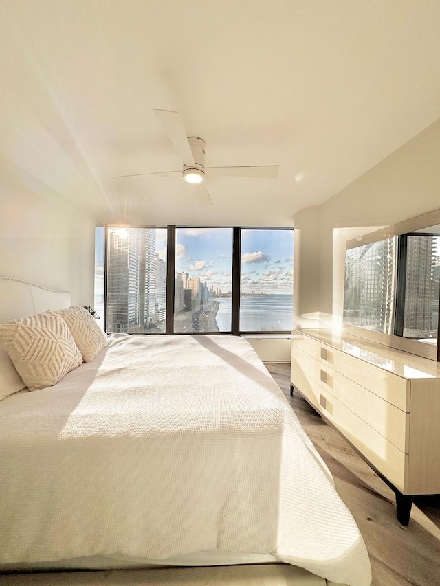 bedroom featuring ceiling fan and hardwood / wood-style flooring