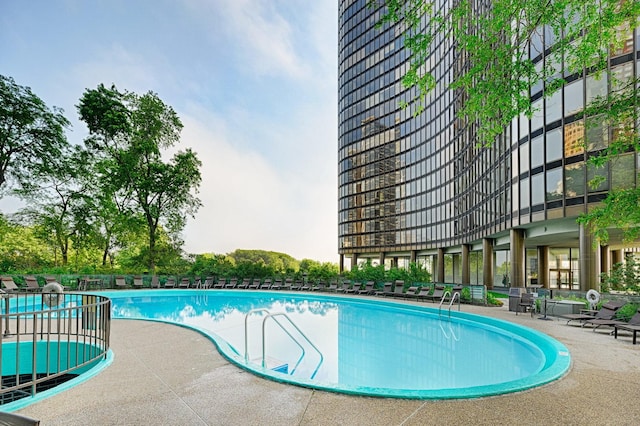 view of swimming pool with a patio