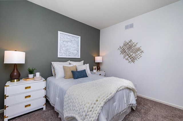 bedroom featuring dark colored carpet