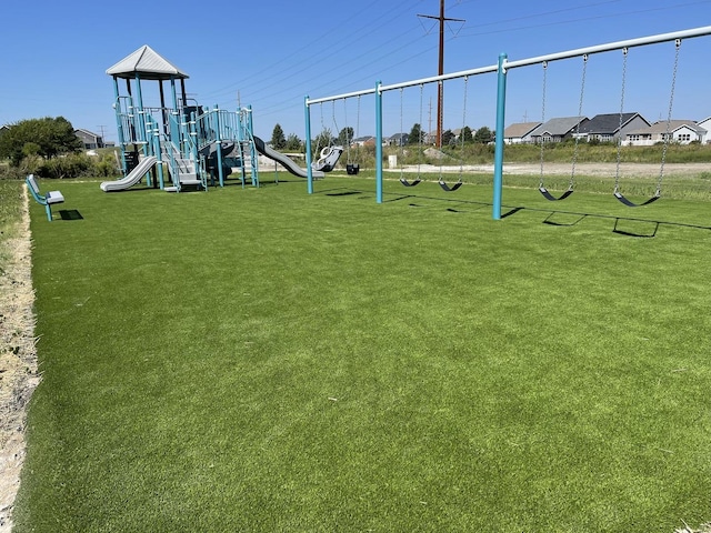 view of jungle gym with a lawn