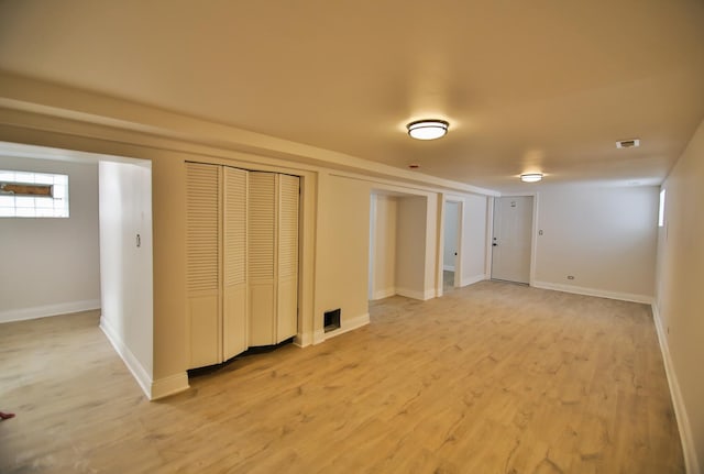 basement featuring light hardwood / wood-style flooring