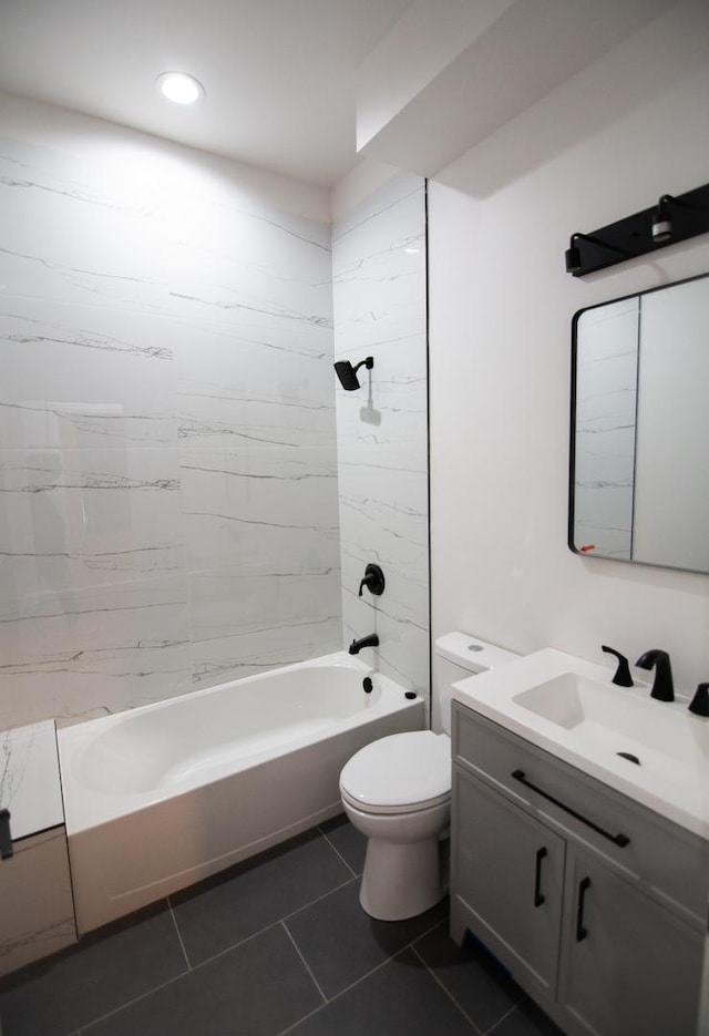 full bathroom with toilet, tiled shower / bath, tile patterned flooring, and vanity