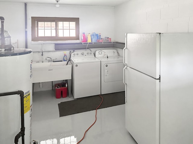 washroom featuring water heater, sink, and washing machine and dryer