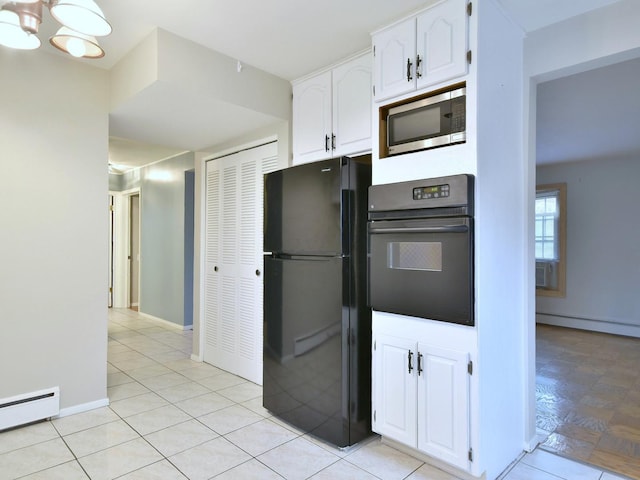 kitchen featuring white cabinets, black refrigerator, a baseboard heating unit, an inviting chandelier, and wall oven