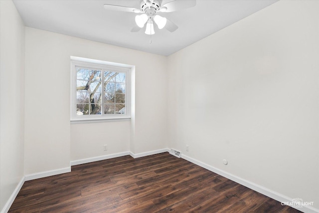 unfurnished room featuring ceiling fan and dark wood-type flooring