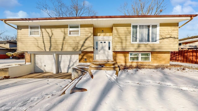 split foyer home featuring a garage