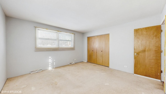 unfurnished bedroom with a closet