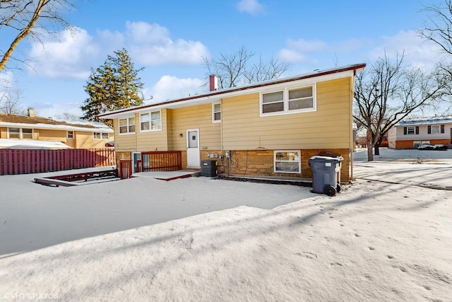 back of property featuring central AC