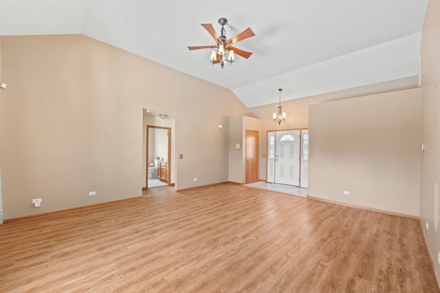 unfurnished living room featuring light hardwood / wood-style flooring, ceiling fan with notable chandelier, and vaulted ceiling