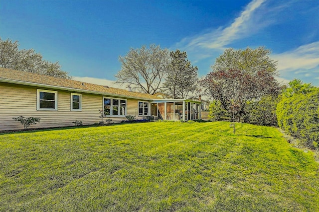 view of yard with a sunroom