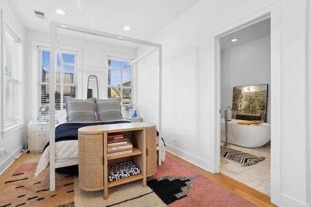 bedroom featuring light wood-type flooring