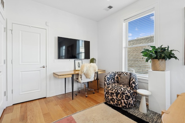 living area featuring hardwood / wood-style floors