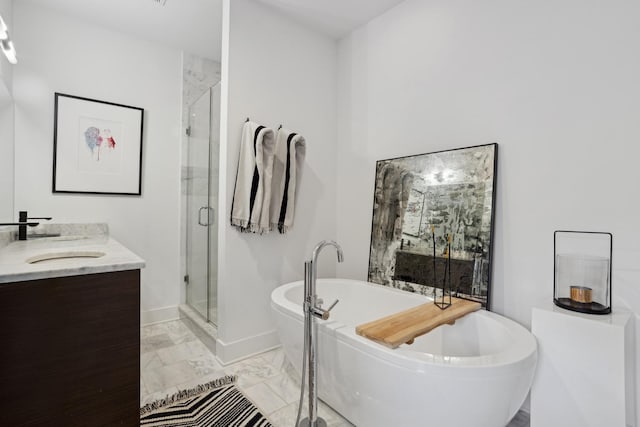 bathroom featuring vanity and independent shower and bath