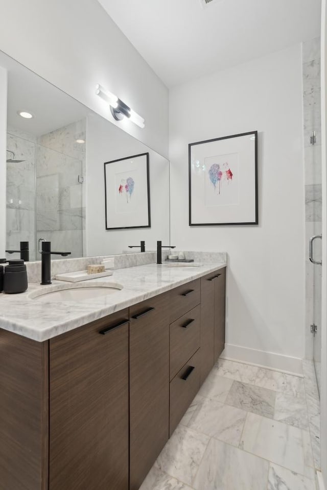 bathroom featuring walk in shower and vanity