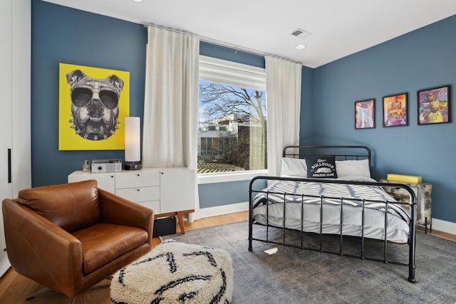 bedroom featuring hardwood / wood-style flooring