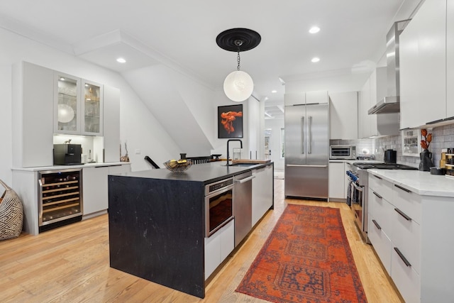 kitchen featuring white cabinetry, tasteful backsplash, beverage cooler, high end appliances, and pendant lighting