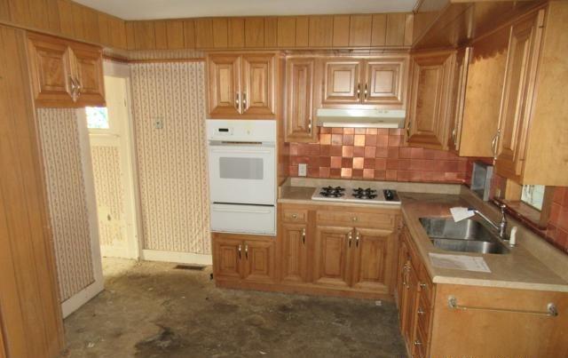 kitchen with sink and white appliances