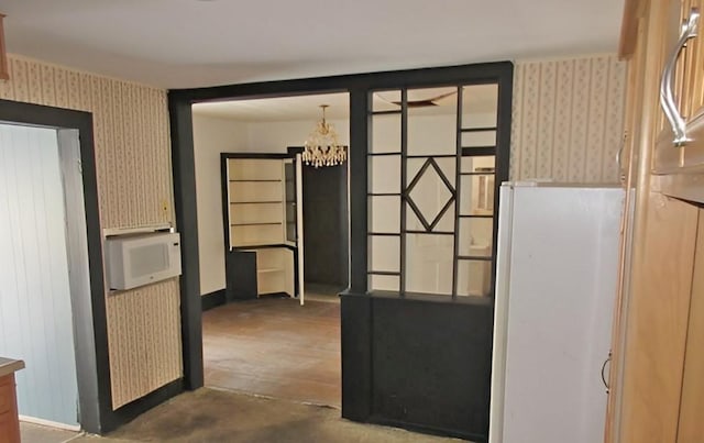 285 Fulton Pl, Canton, IL 61520 - hall featuring wallpapered walls and a chandelier