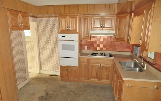 285 Fulton Pl, Canton, IL 61520 - kitchen featuring white appliances, a warming drawer, under cabinet range hood, light countertops, and backsplash