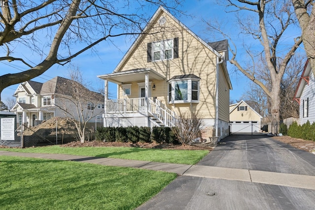 view of front of home featuring a front yard and a porch