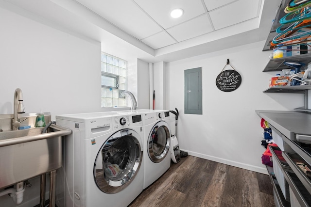 washroom with dark hardwood / wood-style floors, electric panel, and independent washer and dryer