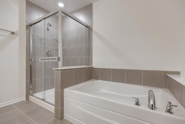 bathroom featuring independent shower and bath and tile patterned floors