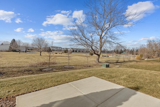 view of yard with a patio area and a rural view