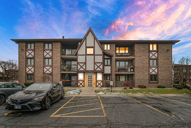 view of outdoor building at dusk