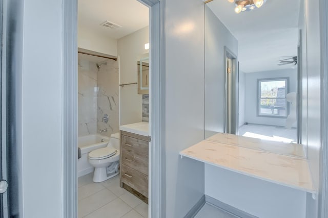 full bathroom with tile patterned floors, toilet, vanity, and tiled shower / bath