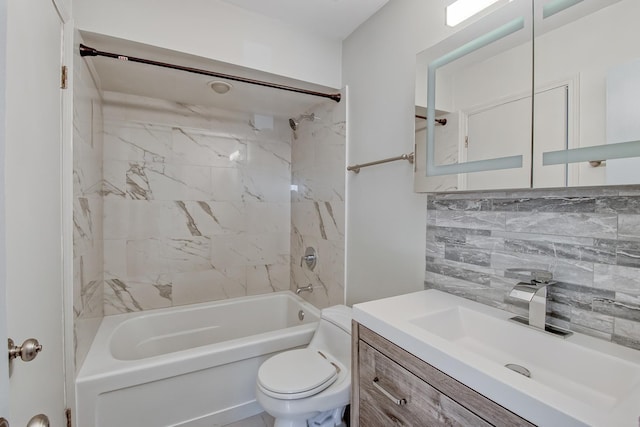 full bathroom featuring toilet, tiled shower / bath combo, backsplash, and vanity