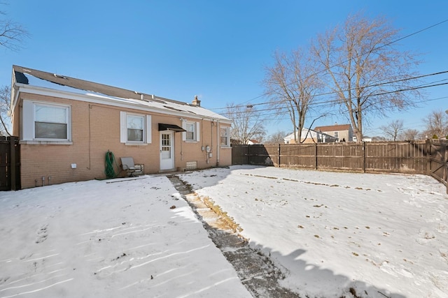 view of snow covered house