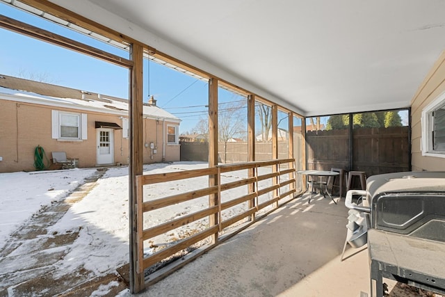 sunroom / solarium featuring a healthy amount of sunlight