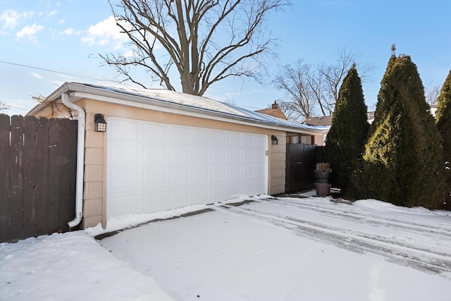 view of snow covered garage