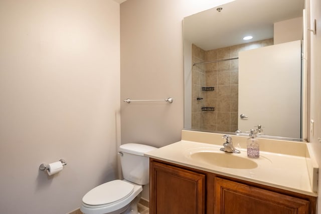 bathroom featuring toilet and vanity