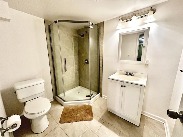 bathroom with an enclosed shower, vanity, tile patterned floors, and toilet