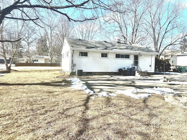 back of property with central AC unit