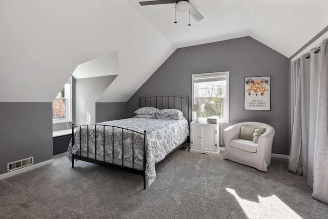 carpeted bedroom featuring ceiling fan and vaulted ceiling