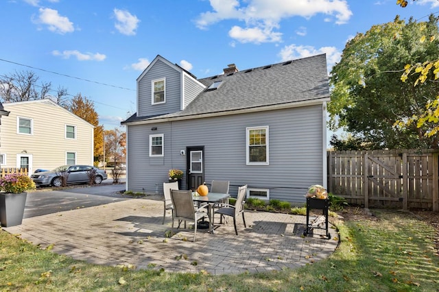 back of property featuring a patio area