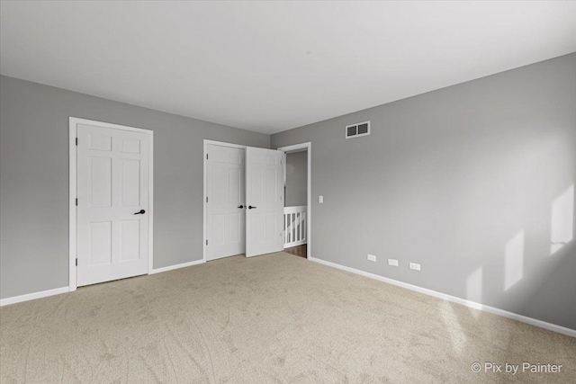 unfurnished bedroom featuring carpet flooring