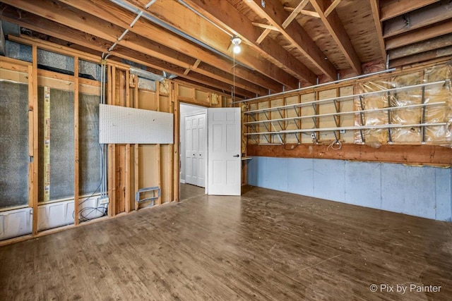 basement featuring dark wood-type flooring