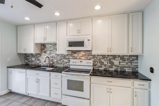 kitchen featuring ceiling fan, backsplash, white appliances, white cabinets, and sink