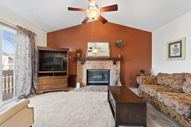 carpeted living room with a ceiling fan, a fireplace, and vaulted ceiling