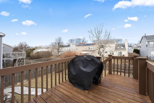 wooden deck featuring a residential view and area for grilling