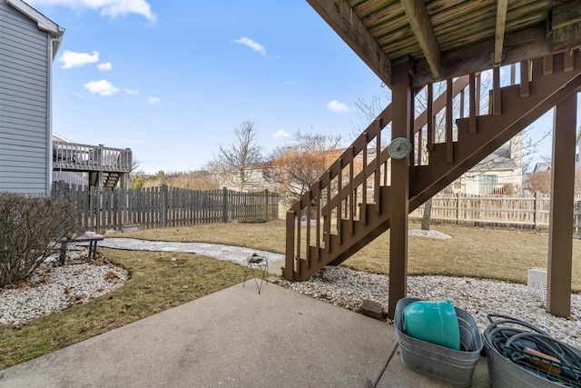 exterior space with a patio, stairway, and a fenced backyard