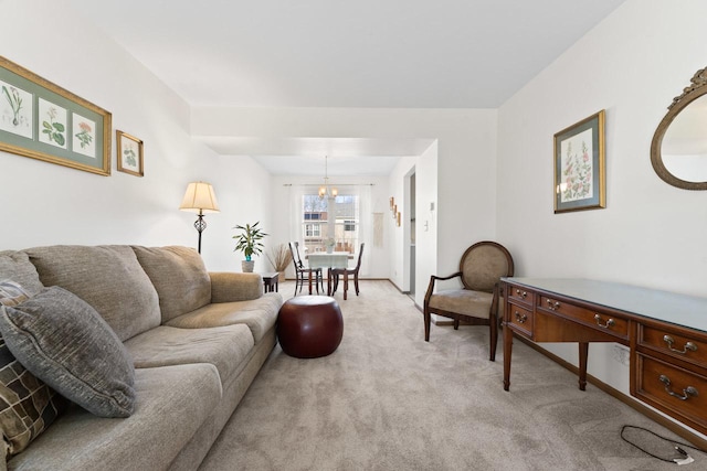 living area with light colored carpet and a notable chandelier