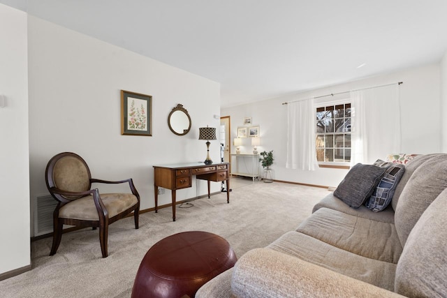 living room with carpet floors, visible vents, and baseboards