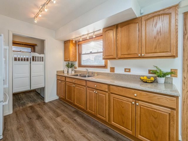 kitchen featuring sink and dark hardwood / wood-style floors