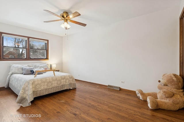 bedroom with wood-type flooring and ceiling fan